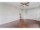 Bedroom with hardwood floors, white wainscoting and double closet doors at 13838 Hill St, Huntersville, NC 28078