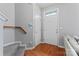 Inviting foyer with wood floors, leading to stairs and other areas at 13838 Hill St, Huntersville, NC 28078