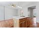 The eat-in kitchen has an island with bar seating, and opens to other living spaces at 13838 Hill St, Huntersville, NC 28078