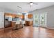Kitchen with island seating, stainless appliances, and double doors leading to backyard at 13838 Hill St, Huntersville, NC 28078