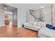 Open-concept living room features new wood floors, natural light, and access to the kitchen at 13838 Hill St, Huntersville, NC 28078
