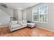 Open-concept living room features new wood floors, natural light, and access to the entryway at 13838 Hill St, Huntersville, NC 28078
