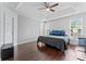 Main bedroom with tray ceilings, hardwood floors, and plenty of natural light at 13838 Hill St, Huntersville, NC 28078