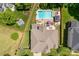 Aerial view of a home with a large backyard, pool, gazebo, and lush landscaping at 143 Heywatchis Dr, Mooresville, NC 28115