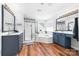 Bright bathroom featuring dual sinks, a soaking tub, and a separate glass shower at 143 Heywatchis Dr, Mooresville, NC 28115