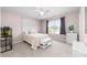 Bedroom with an aquarium, white furniture, ceiling fan, and a large window with backyard view at 143 Heywatchis Dr, Mooresville, NC 28115