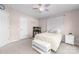 Bedroom with an aquarium, bench, ceiling fan, neutral carpet, and small side table at 143 Heywatchis Dr, Mooresville, NC 28115