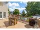 Large wooden deck with a grill and outdoor seating area that overlooks the beautiful backyard pool at 143 Heywatchis Dr, Mooresville, NC 28115