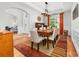Stylish dining room featuring hardwood floors, modern lighting, and a large table for Gathering gatherings and entertaining at 143 Heywatchis Dr, Mooresville, NC 28115