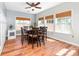 Dining room features a large wooden table, matching chairs, and bright natural lighting at 143 Heywatchis Dr, Mooresville, NC 28115