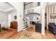 Elegant foyer with hardwood floors, staircase, and archways leading to living areas at 143 Heywatchis Dr, Mooresville, NC 28115