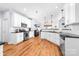 Spacious kitchen featuring stainless steel appliances, modern cabinetry, and hardwood flooring at 143 Heywatchis Dr, Mooresville, NC 28115