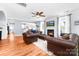Inviting living room with a fireplace, hardwood floors, and comfortable leather seating, offering a relaxing ambiance at 143 Heywatchis Dr, Mooresville, NC 28115