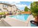 Large pool with patio furniture, decking, waterfall feature, and well-manicured landscaping at 143 Heywatchis Dr, Mooresville, NC 28115