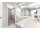 Bathroom with a double sink vanity, large mirror, walk-in closet, and shower at 14857 Santa Lucia Dr, Charlotte, NC 28277