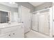 This bathroom features a white vanity and a glass-enclosed shower at 14857 Santa Lucia Dr, Charlotte, NC 28277