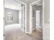 Open doorway to a carpeted bedroom with a window providing natural light at 14857 Santa Lucia Dr, Charlotte, NC 28277