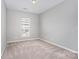 Neutral bedroom with carpet and a window, ready for personalization at 14857 Santa Lucia Dr, Charlotte, NC 28277