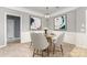 Charming dining room with round table, seating for four, updated lighting, and modern artwork at 14857 Santa Lucia Dr, Charlotte, NC 28277