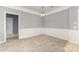 This dining room boasts decorative wall trim, a modern chandelier, and neutral walls at 14857 Santa Lucia Dr, Charlotte, NC 28277