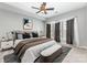 Comfortable main bedroom with updated ceiling fan, stylish window coverings, and updated decor at 14857 Santa Lucia Dr, Charlotte, NC 28277