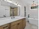 Elegant bathroom featuring a soaking tub, spacious vanity, and a beautifully tiled walk-in shower with glass door at 153 Mills Garden Rd, Statesville, NC 28625