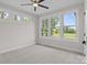 Well-lit bedroom featuring neutral walls, plush carpet, and large windows at 153 Mills Garden Rd, Statesville, NC 28625