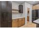 Well-designed kitchen area with a mix of dark and light wood cabinetry, modern appliances, and elegant countertops at 153 Mills Garden Rd, Statesville, NC 28625