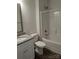 Bathroom featuring single granite vanity and white tub/shower combo at 1604 N Main St, Mount Holly, NC 28120