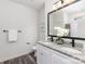 Clean bathroom with double vanity, granite countertop, black fixtures, and a large mirror at 1604 N Main St, Mount Holly, NC 28120