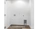 Laundry room featuring wood-look floors and white walls with hookups at 1604 N Main St, Mount Holly, NC 28120