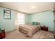 Comfortable bedroom with natural light and neutral carpeting at 161 Crystal Bay Dr, Mooresville, NC 28115