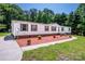 Charming manufactured home featuring a well maintained yard, and warm curb appeal at 161 Crystal Bay Dr, Mooresville, NC 28115