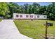 Charming home with well-manicured lawn, a long driveway, and a traditional mailbox at 161 Crystal Bay Dr, Mooresville, NC 28115