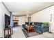 Comfortable living room with a fireplace, ceiling fan, and ample natural light at 161 Crystal Bay Dr, Mooresville, NC 28115