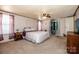Spacious main bedroom with large windows, ceiling fan, and en-suite bath at 161 Crystal Bay Dr, Mooresville, NC 28115