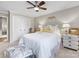 Comfortable bedroom boasts neutral colors, ceiling fan, and double door closet at 161 Perrin Pl, Charlotte, NC 28207