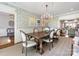 Elegant dining room with decorative wallpaper, chandelier, and large table at 161 Perrin Pl, Charlotte, NC 28207