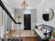 Foyer features hardwood floors, a bench, and access to the staircase at 161 Perrin Pl, Charlotte, NC 28207