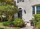 Close up of the front door with decorative details and lush landscaping at 161 Perrin Pl, Charlotte, NC 28207