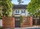 Charming home entrance with a unique brick fence and gated entry, offering privacy and curb appeal at 161 Perrin Pl, Charlotte, NC 28207