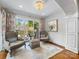 Charming sitting room with patterned curtains and a view of the back yard at 161 Perrin Pl, Charlotte, NC 28207
