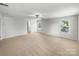 Expansive bedroom with three large windows offering ample natural light, and a ceiling fan at 1814 Tradd Ave, Clover, SC 29710