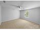 Neutral bedroom featuring wall-to-wall carpet and a window at 1814 Tradd Ave, Clover, SC 29710