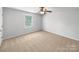 Bedroom featuring neutral walls, carpet flooring, one window, and a modern ceiling fan at 1814 Tradd Ave, Clover, SC 29710