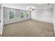 Spacious bedroom featuring three windows, a ceiling fan and decorative wall trim at 1814 Tradd Ave, Clover, SC 29710