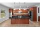 Gourmet kitchen features dark granite counters, stainless appliances, and center island at 1814 Tradd Ave, Clover, SC 29710
