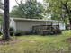 Exterior showcases a backyard with deck, complemented by lush lawn at 1925 Mt Hope Church Rd, Salisbury, NC 28146
