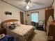 A bedroom offering natural light, ceiling fan and ample storage space in the built-in wardrobe at 1925 Mt Hope Church Rd, Salisbury, NC 28146