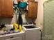 Functional laundry room with washer, dryer, and upper cabinets for storage at 1925 Mt Hope Church Rd, Salisbury, NC 28146